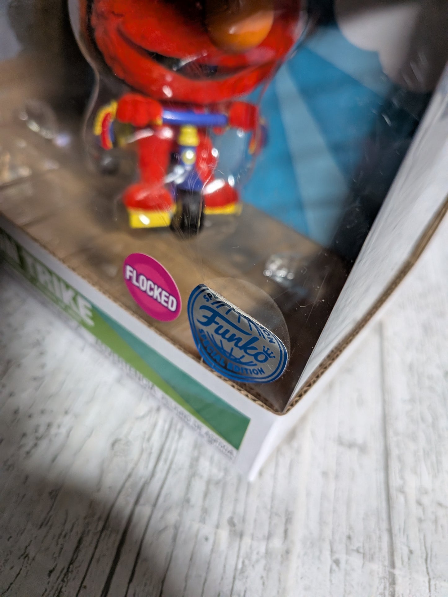 Funko Pop Sesamstraße Nr. 309 – Elmo auf dem Dreirad (beflockt)