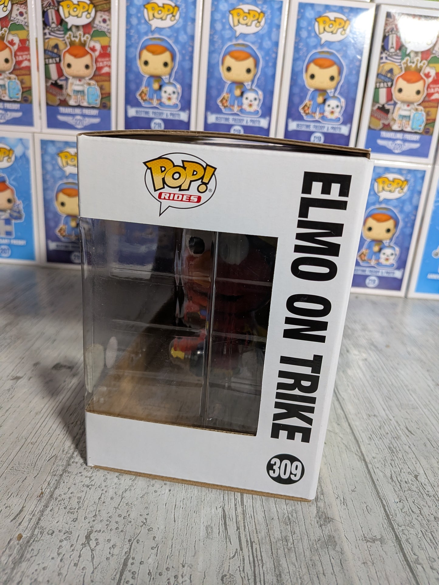 Funko Pop Sesamstraße Nr. 309 – Elmo auf dem Dreirad (beflockt)